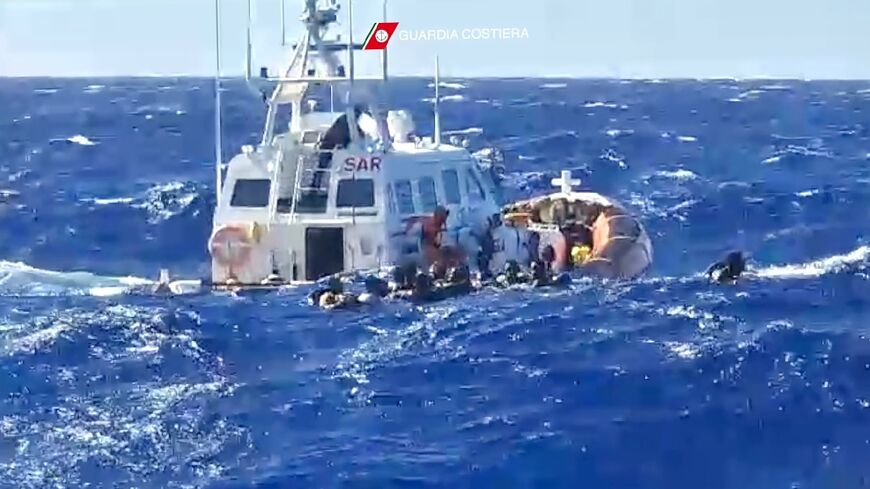 An Italian Coastguard vessel rescuing migrants near Lampedusa on Saturday