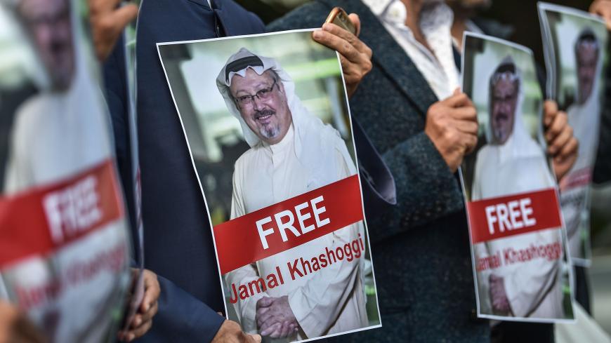 TOPSHOT - Protestors hold pictures of missing journalist Jamal Khashoggi during a demonstration in front of the Saudi Arabian consulate in Istanbul on October 5, 2018. - Jamal Khashoggi, a veteran Saudi journalist who has been critical towards the Saudi government has gone missing after visiting the kingdom's consulate in Istanbul on October 2, 2018, the Washington Post reported. (Photo by OZAN KOSE / AFP)        (Photo credit should read OZAN KOSE/AFP/Getty Images)