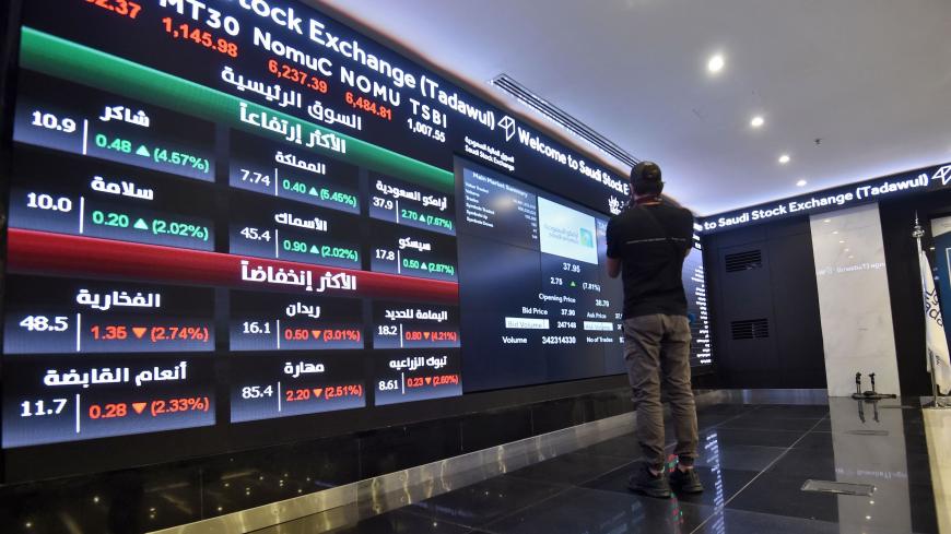 This picture taken December 12, 2019 shows a view of the board at the Stock Exchange Market (Tadawul) bourse in Riyadh. - Energy giant Saudi Aramco's market value soared above $2 trillion as its share price surged again on its second day of trading. The valuation milestone was sought by Saudi Crown Prince Mohammed bin Salman when he first floated the idea of selling up to five percent of Aramco, the world's largest oil firm, about four years ago. Aramco shares jumped another 9.7 percent to 38.60 riyals ($10