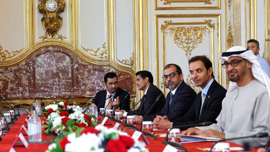 United Arab Emirates President Sheikh Mohamed bin Zayed al-Nahyan (R) looks on during a meeting.