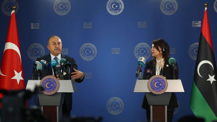 Libyan Foreign Minister Najla al-Mangoush (R) and Turkish Foreign Minister Mevlut Cavusoglu.