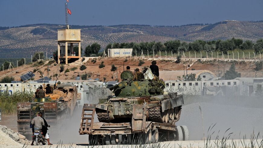 Members of the Hayat Tahrir al-Sham (HTS) jihadist group bring reinforcements.