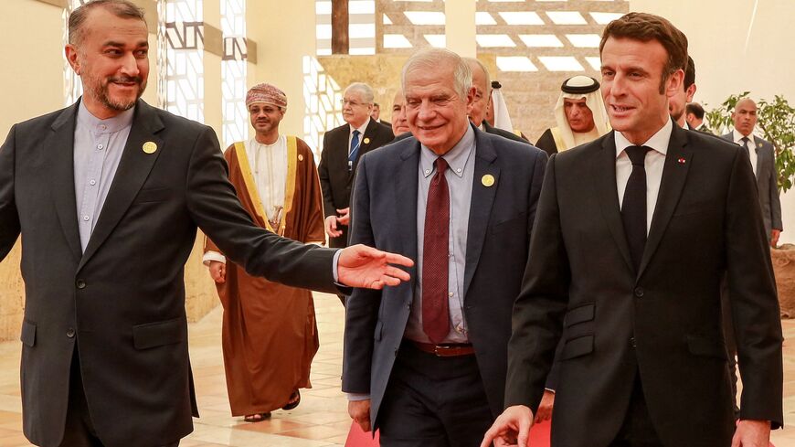 Iranian Foreign Minister Hossein Amir-Abdollahian, the High Representative of the European Union for Foreign Affairs and Security Policy Josep Borrell, and French President Emmanuel Macron arrive with other dignitaries at the start of the "Baghdad Conference for Cooperation and Partnership" in Sweimeh by the Dead Sea shore in central-west Jordan on Dec. 20, 2022.  