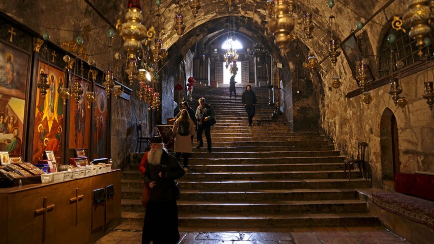 Worshippers visit the tomb of the Virgin Mary in Jerusalem on March 19, 2023 following an attack by Israelis. - The Greek Orthodox Church of Jerusalem condemned the "heinous" attack that took place during Sunday mass at the Church of the Sepulchre of Saint Mary. (Photo by HAZEM BADER / AFP) (Photo by HAZEM BADER/AFP via Getty Images)