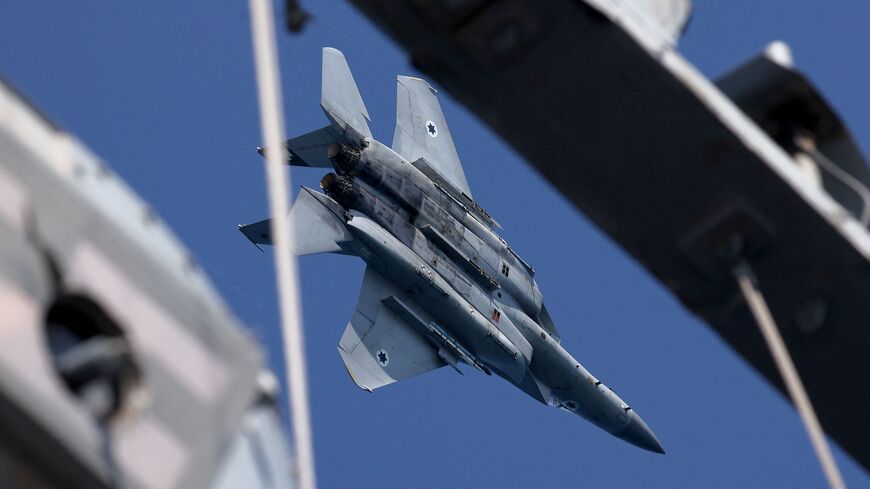 An Israeli F-15 Eagle fighter aircraft performs manuevers during the "Noble Dina 23" multilateral aeronautical exercise over the Mediterranean sea on March 27, 2023. (Photo by JACK GUEZ / AFP) (Photo by JACK GUEZ/AFP via Getty Images)