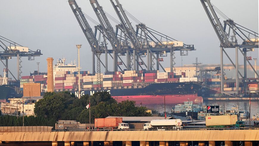 Shipping containers are seen stacked on a ship at a sea port in Karachi on April 6, 2023. (Photo by Aamir QURESHI / AFP) (Photo by AAMIR QURESHI/AFP via Getty Images)