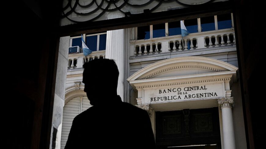A man stands in front of Argentina's Central Bank in Buenos Aires, on May 15, 2023. 