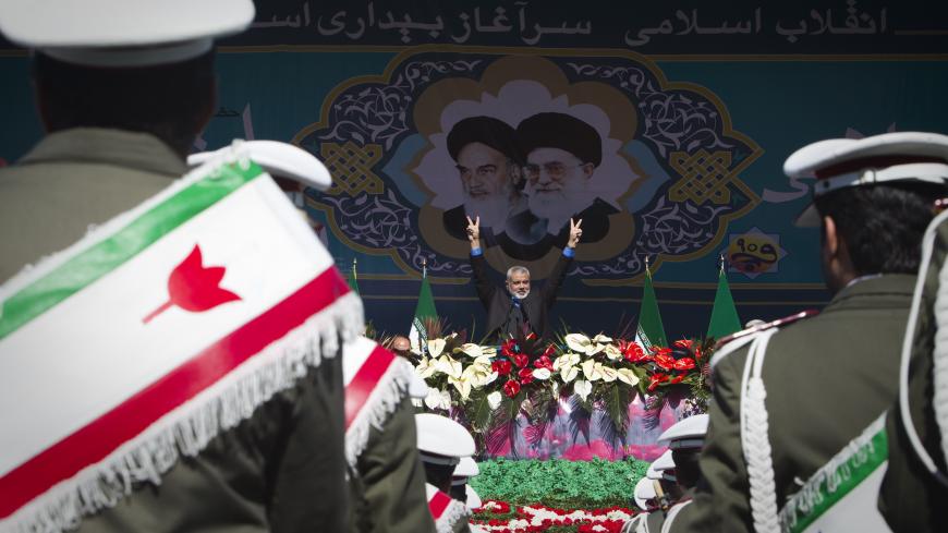 EDITORS' NOTE: Reuters and other foreign media are subject to Iranian restrictions on leaving the office to report, film or take pictures in Tehran.

Hamas Leader Ismail Haniyeh flashes the victory sign during a ceremony to mark the 33rd anniversary of the Islamic Revolution, in Tehran's Azadi square February 11, 2012. Iran's President Mahmoud Ahmadinejad said on the anniversary of the revolution that the Islamic Republic would soon announce "very important" REUTERS/Raheb Homavandi  (IRAN - Tags: ANNIVERS