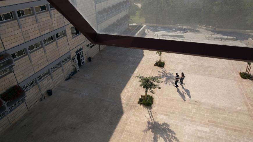 Students walk at the campus of the Ariel University Centre in the West Bank Jewish settlement of Ariel September 13, 2012. An Israeli government move to upgrade Ariel University Centre in the occupied West Bank to a full-fledged university has put the 30-year-old school at the centre of a debate at the core of the Israeli-Palestinian conflict: how the settlements will figure in defining a future Palestinian state. Picture taken September 13, 2012. To match Feature PALESTINIANS-ISRAEL/SETTLEMENTS  REUTERS/Ro