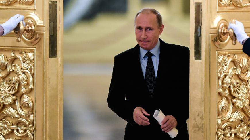 Russian President Vladimir Putin enters a hall to meet with members of the Presidential Council for Civil Society and Human Rights at the Kremlin in Moscow, Russia October 30, 2017. REUTERS/Kirill Kudryavtsev/Pool - RC1E30F1E010