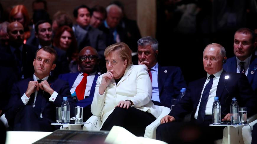 French President Emmanuel Macron, German Chancellor Angela Merkel and Russian President Vladimir Putin attend the opening session of the Paris Peace Forum as part of the commemoration ceremony for Armistice Day, 100 years after the end of the First World War, in Paris, France, November 11, 2018. REUTERS/Gonzalo Fuentes/Pool - RC1CEA9A8270