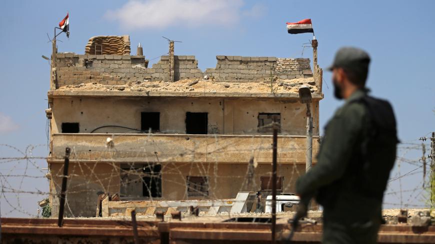 A member of Palestinian security forces, loyal to Hamas, stands guard at the border area with Egypt, in the southern Gaza Strip, June 23, 2019. Picture taken June 23, 2019. REUTERS/Ibraheem Abu Mustafa - RC1FA4398160