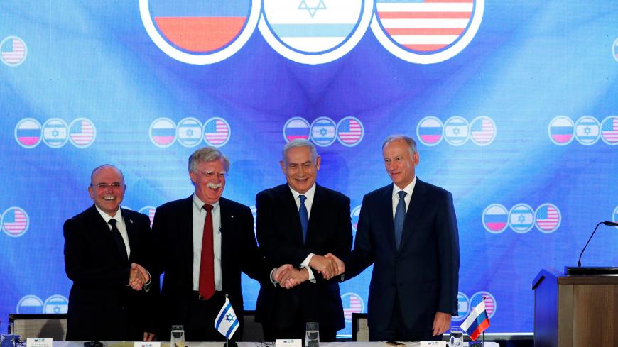 Israeli Prime Minister Benjamin Netanyahu, U.S national security adviser John Bolton, Nikolai Patrushev, secretary of the Russian Security Council, and Israeli national security adviser Meir Ben-Shabbat, shake hands during opening statements of a trilateral meeting between the American, Israeli and Russian top security advisers in Jerusalem June 25, 2019. REUTERS/Ronen Zvulun - RC19617B1520