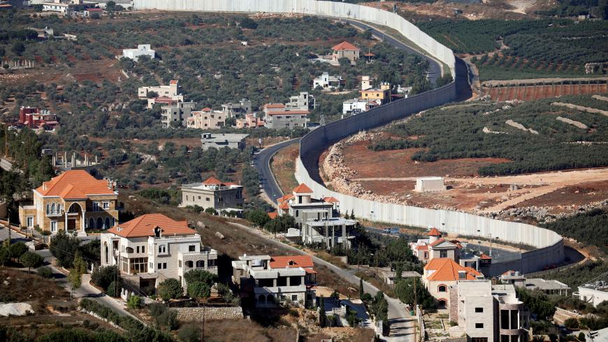 A general view picture shows the Lebanese village of Adaisseh on the left-hand-side of the Israel-Lebanon border, as seen from Kibbutz Misgav Am in northern Israel August 26, 2019. REUTERS/Amir Cohen - RC165B60A890