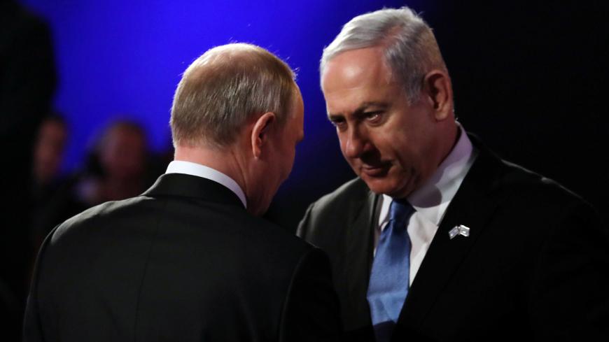 Russian President Vladimir Putin with Israeli Prime Minister Benjamin Netanyahu during the Fifth World Holocaust Forum at the Yad Vashem Holocaust memorial museum in Jerusalem, January 23, 2020. Abir Sultan/Pool via REUTERS - RC2QLE9DQP5U