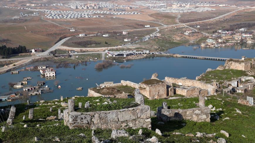 An old cemetery is seen in Hasankeyf, which will be significantly submerged by the Ilisu Dam, with new Hasankeyf in the background in southeastern Batman province, Turkey, February 20, 2020. Picture taken February 20, 2020. REUTERS/Murad Sezer - RC2P7F95MH1O