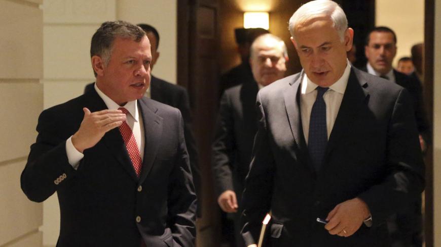 Jordan's King Abdullah (L) walks with Israel's Prime Minister Benjamin Netanyahu before their meeting at the Royal Palace in Amman January 16, 2014. REUTERS/Jordanian Royal Palace/Yousef Allan/Handout via Reuters (JORDAN - Tags: POLITICS) ATTENTION EDITORS - THIS IMAGE WAS PROVIDED BY A THIRD PARTY. FOR EDITORIAL USE ONLY. NOT FOR SALE FOR MARKETING OR ADVERTISING CAMPAIGNS. THIS PICTURE IS DISTRIBUTED EXACTLY AS RECEIVED BY REUTERS, AS A SERVICE TO CLIENTS - GM1EA1G1K2N01