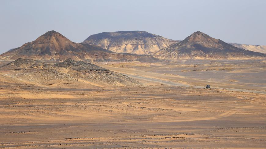 A car crosses the Egyptian western desert and the Bahariya Oasis in Siwa, southwest of Cairo, Egypt May 15, 2015. Picture taken May 15, 2015. REUTERS/Amr Abdallah Dalsh - RC1ADA96C670