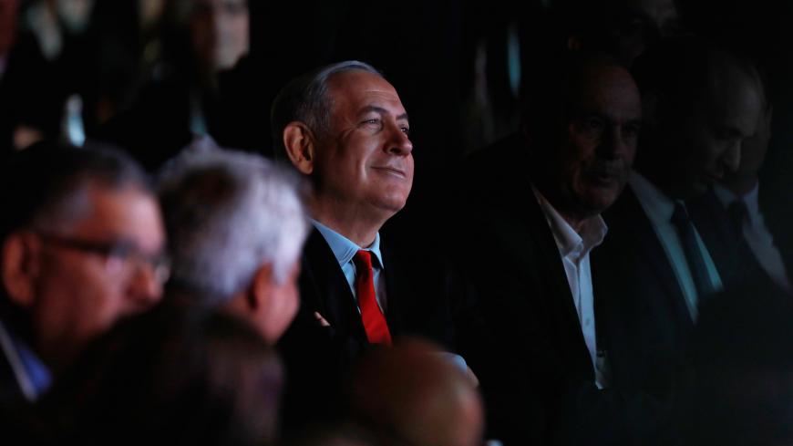 Israeli Prime Minister Benjamin Netanyahu sits in the audience ahead of a planned address at the Muni World 2018 conference in Tel Aviv, Israel February 14, 2018. REUTERS/Nir Elias - RC1B832C7E70