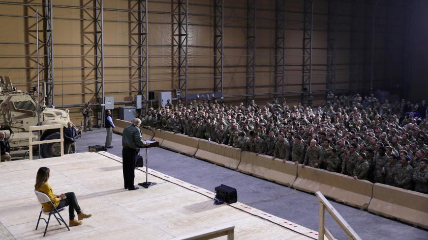 U.S. President Donald Trump delivers remarks to U.S. troops in an unannounced visit to Al Asad Air Base, Iraq December 26, 2018. REUTERS/Jonathan Ernst - RC1801320710