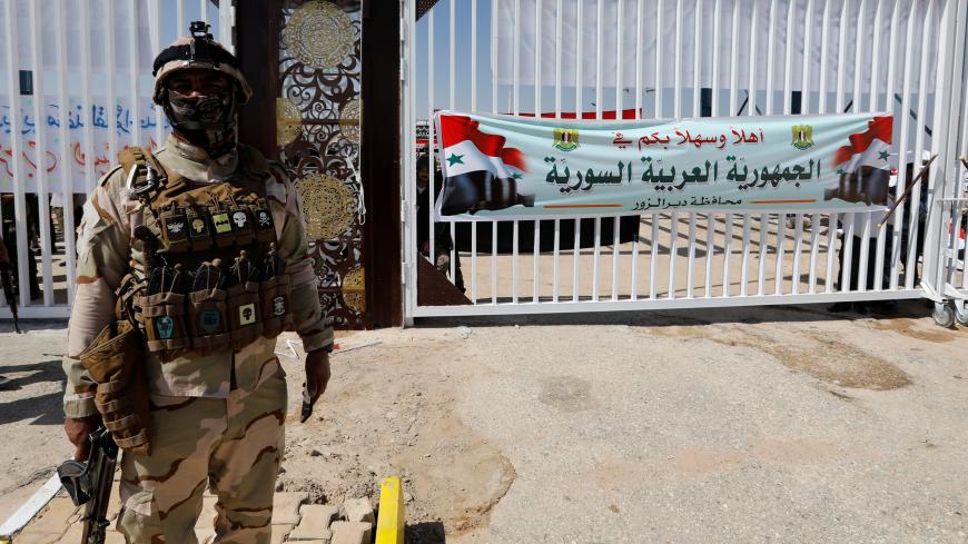 An Iraqi soldier is seen at the Iraqi-Syrian border, after it has been reopened for trade and travel, in Al Qaim, Iraq September 30, 2019. REUTERS/Thaier Al-Sudani - RC1BBBE58A40