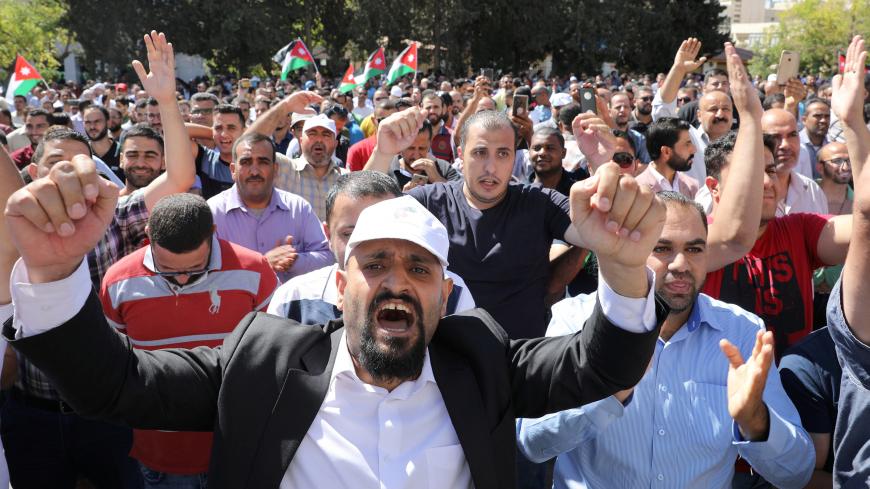 Public schools' teachers take part in a protest as part of their strike in Amman, Jordan October 3, 2019.  REUTERS/Muhammad Hamed - RC11EE9CDE20