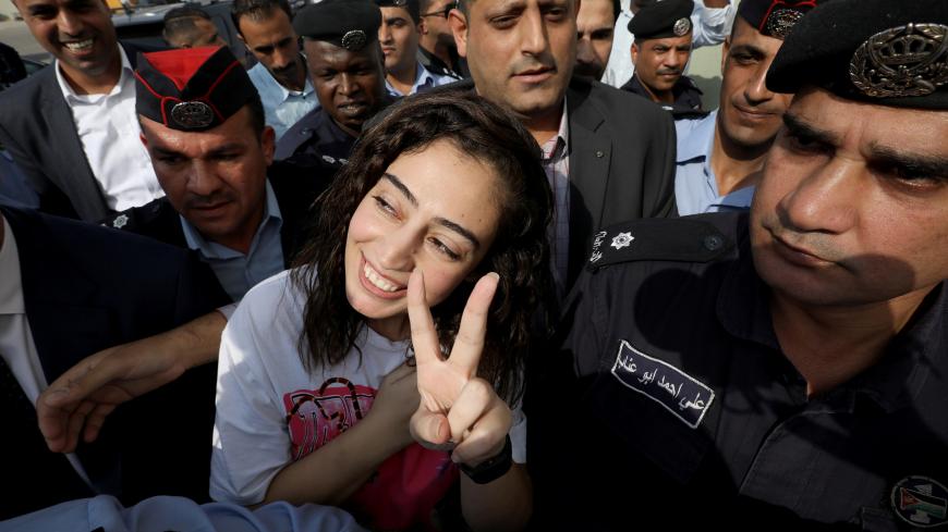 Jordanian citizen Hiba Labadi gestures upon her release by Israel, at the King Hussein Bridge crossing near Amman, Jordan, November 6, 2019. REUTERS/Muhammad Hamed - RC2N5D9H4IBL