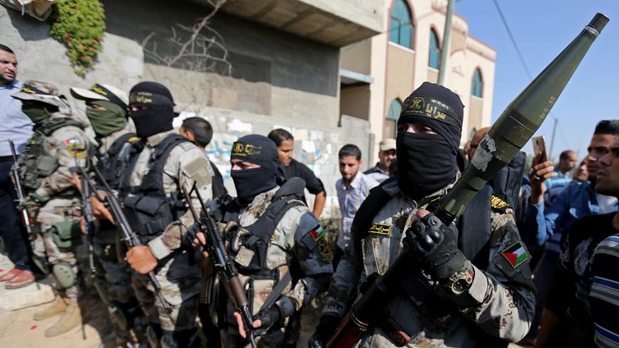 Palestinian Islamic Jihad militants take part in the funeral of their comrade in the southern Gaza Strip November 14, 2019. REUTERS/Ibraheem Abu Mustafa - RC2XAD9J6T7X